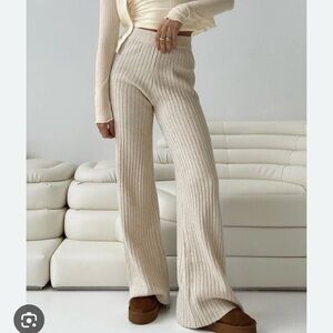 Beige Botany cream ribbed knit flare pants green hem